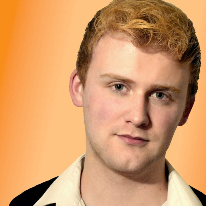 A male model facial portrait against an orange background